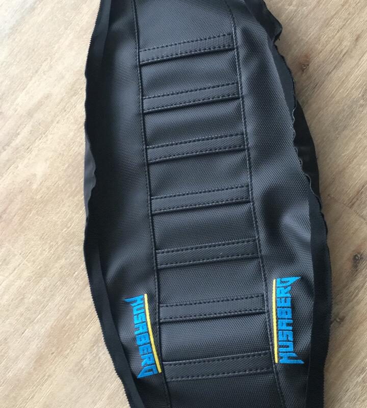 Husaberg 2013-2016 all black foam filled gripper strips with rubber Husaberg logo on sides.